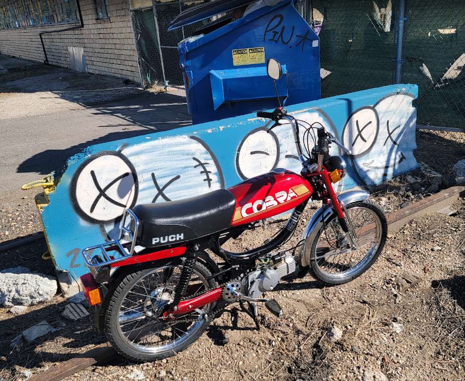 1984 Puch Cobra red, dumpster wall