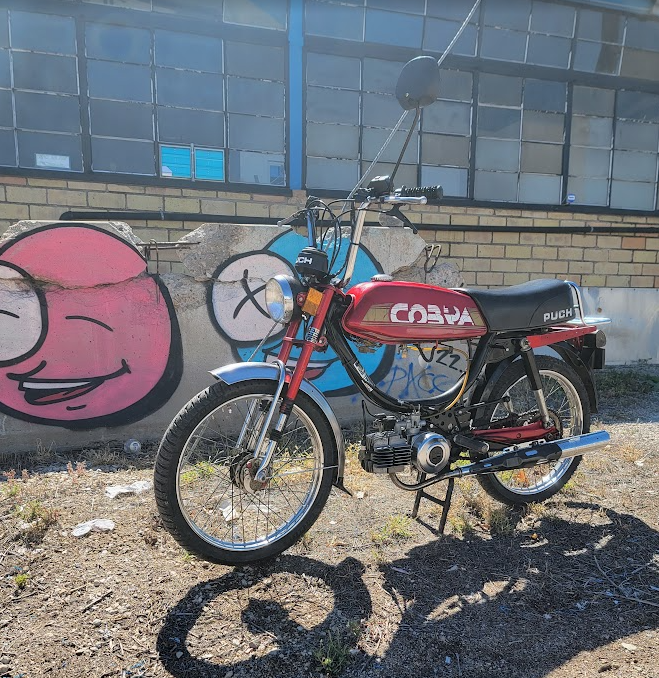 1984 Puch Cobra red, graffiti wall