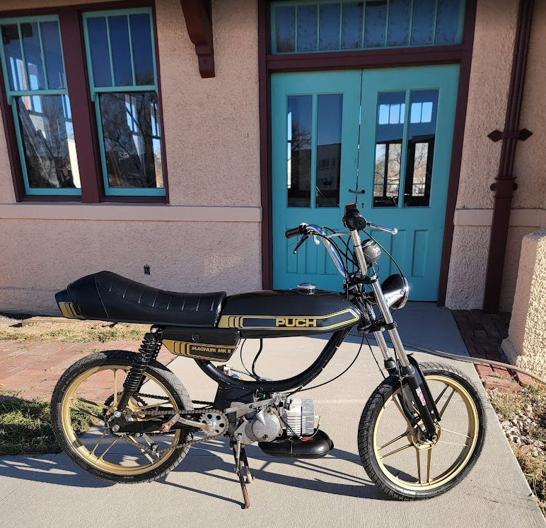 1980 Puch Magnum black and gold, train depot backdrop