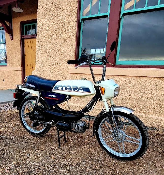 1986 Puch Cobra, white and navy, train depot backdrop