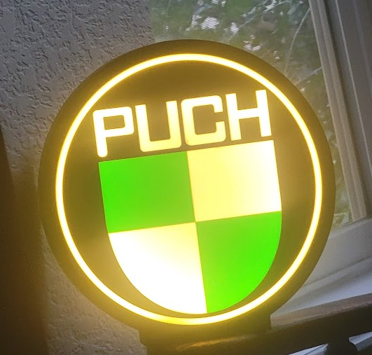 Light-up Puch badge sign