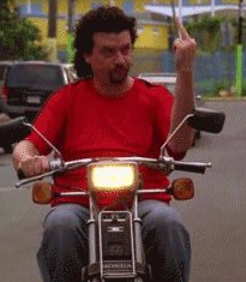 Guy on a moped throwing up a middle finger